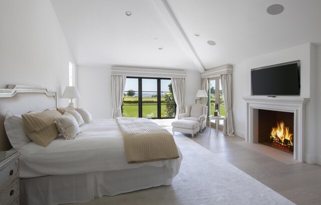 2720 Montecito Ranch Pl, Summerland, CA 93067 - bedroom featuring light wood-style flooring, a fireplace with flush hearth, and access to exterior