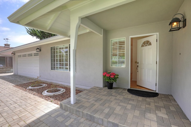 6231 Covington Way, Goleta, CA 93117 - doorway to property featuring a garage, stucco siding, and driveway