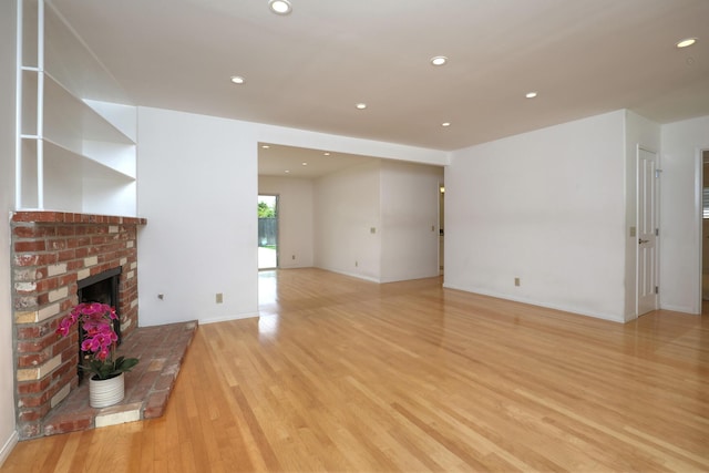 6231 Covington Way, Goleta, CA 93117 - unfurnished living room featuring light wood finished floors, a brick fireplace, recessed lighting, and baseboards