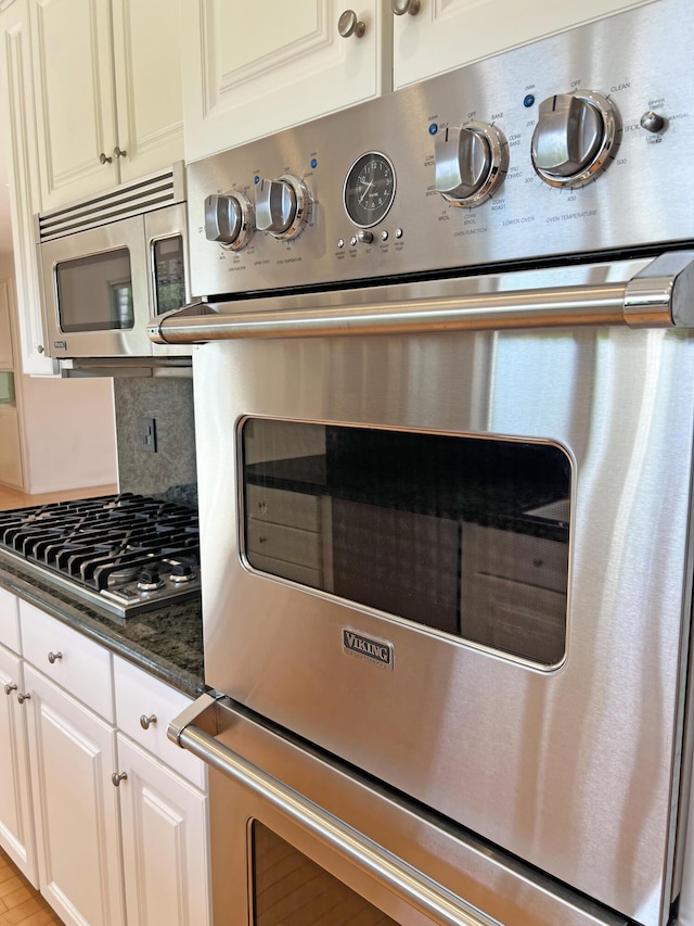 6231 Covington Way, Goleta, CA 93117 - kitchen view of appliances with stainless steel finishes, decorative backsplash, and white cabinets