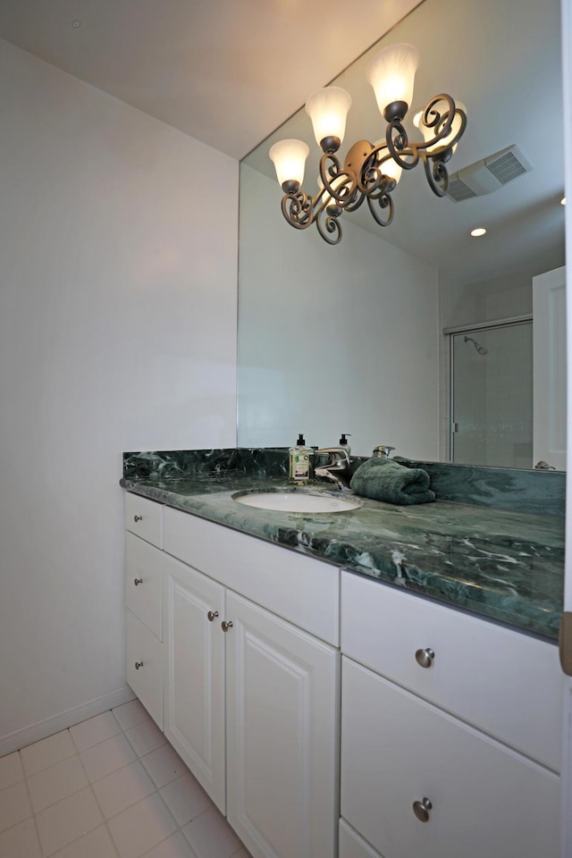 6231 Covington Way, Goleta, CA 93117 - full bathroom featuring vanity, a chandelier, tile patterned floors, and baseboards