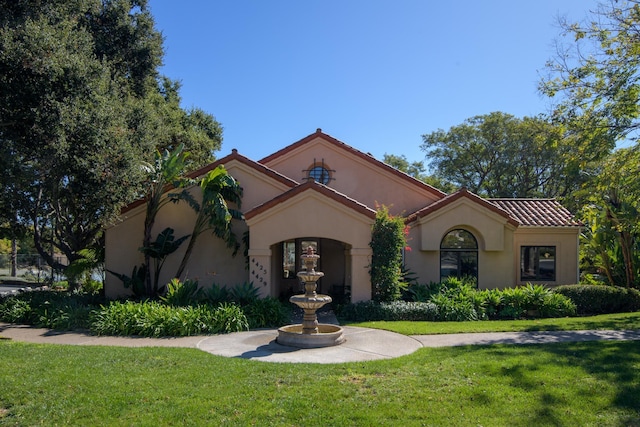 4477 S Shadow Hills Blvd Unit E, Santa Barbara, CA 93105 - mediterranean / spanish-style house with a front lawn, stucco siding, and a tiled roof