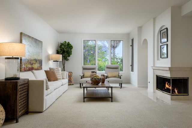 4477 S Shadow Hills Blvd Unit E, Santa Barbara, CA 93105 - carpeted living area with a premium fireplace, arched walkways, and baseboards