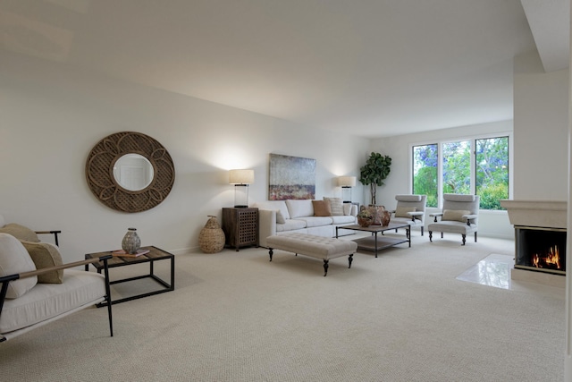 4477 S Shadow Hills Blvd Unit E, Santa Barbara, CA 93105 - living area featuring carpet, a warm lit fireplace, and baseboards