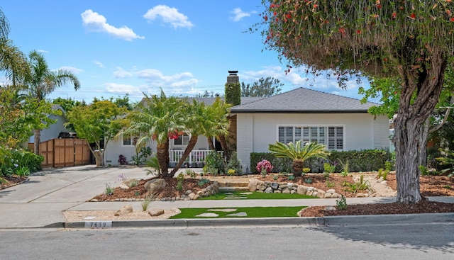 7659 Dartmoor Ave, Goleta, CA 93117 - view of front facade featuring a chimney, a porch, a gate, and stucco siding