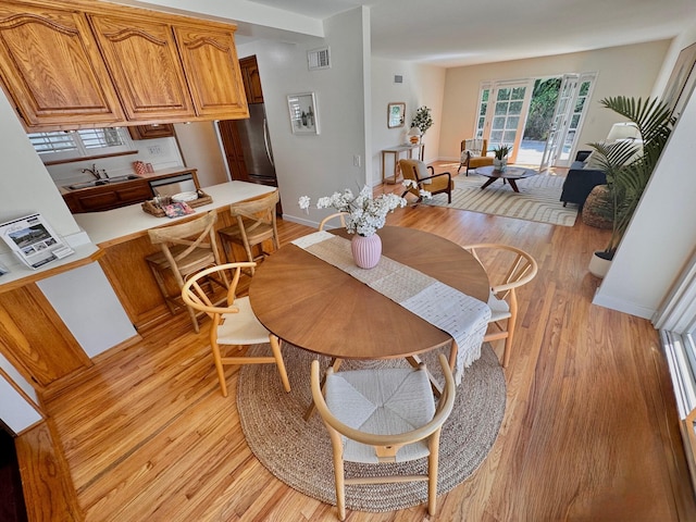 7659 Dartmoor Ave, Goleta, CA 93117 - dining space with light wood-style flooring