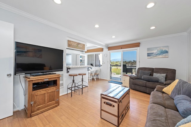 4975 Sandyland Rd Unit 302, Carpinteria, CA 93013 - living room with crown molding, recessed lighting, light wood-style flooring, and baseboards