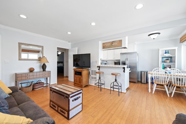 4975 Sandyland Rd Unit 302, Carpinteria, CA 93013 - living room with crown molding, light wood-style flooring, and recessed lighting