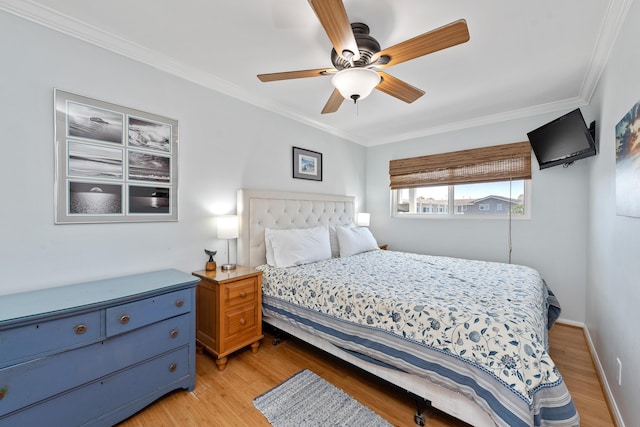 4975 Sandyland Rd Unit 302, Carpinteria, CA 93013 - bedroom featuring ornamental molding, light wood-style floors, and a ceiling fan