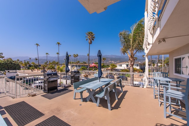 4975 Sandyland Rd Unit 302, Carpinteria, CA 93013 - view of patio / terrace with a grill, a mountain view, and outdoor dining area