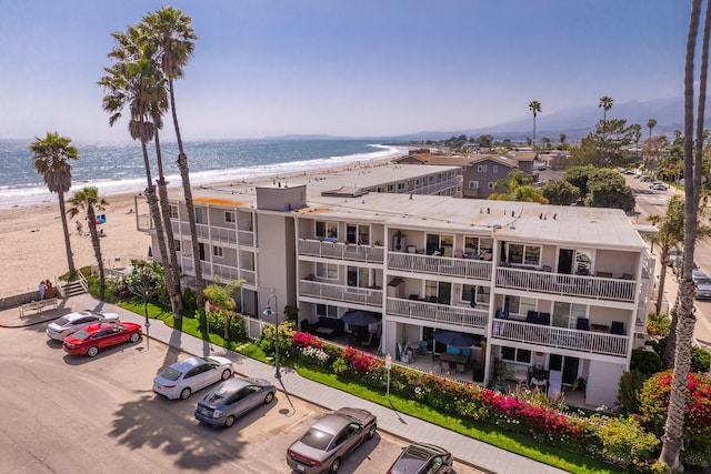 4975 Sandyland Rd Unit 302, Carpinteria, CA 93013 - view of building exterior with uncovered parking and view of water and beach