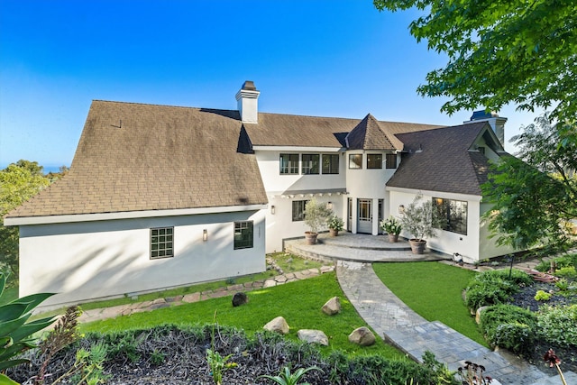 1157 Glenview Rd, Montecito, CA 93108 - rear view of property with a chimney, stucco siding, a yard, and roof with shingles