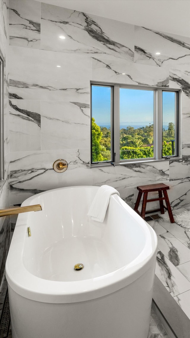 1157 Glenview Rd, Montecito, CA 93108 - bathroom with plenty of natural light, marble finish floors, and a freestanding bath