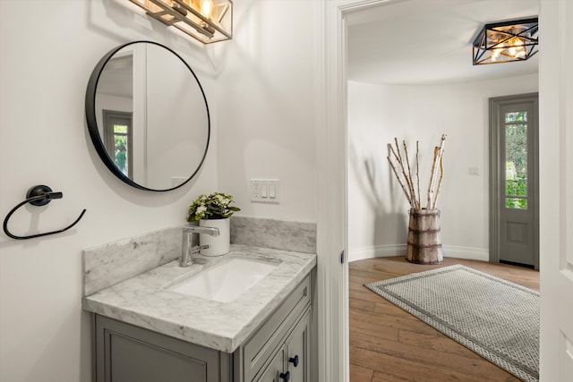 1157 Glenview Rd, Montecito, CA 93108 - bathroom with a chandelier, vanity, and wood finished floors
