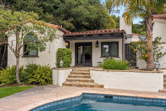 1151 Glenview Rd, Montecito, CA 93108 - rear view of house with french doors, a tile roof, stucco siding, and an outdoor pool