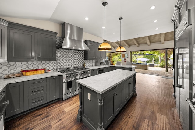 1151 Glenview Rd, Montecito, CA 93108 - kitchen featuring range with two ovens, wall chimney range hood, a peninsula, decorative backsplash, and dark wood-style floors