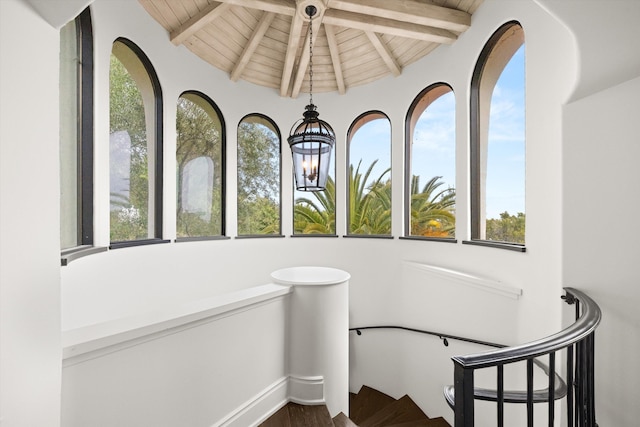 1151 Glenview Rd, Montecito, CA 93108 - stairway with a wooden ceiling with exposed beams and wood finished floors