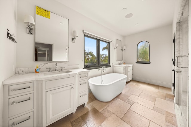 1151 Glenview Rd, Montecito, CA 93108 - full bathroom featuring stone tile flooring, two vanities, and a freestanding bath