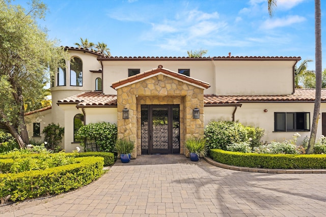 1151 Glenview Rd, Montecito, CA 93108 - mediterranean / spanish house featuring stucco siding, a tile roof, and stone siding
