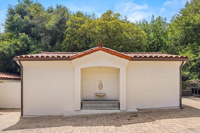 1151 Glenview Rd, Montecito, CA 93108 - property entrance with a tiled roof and stucco siding