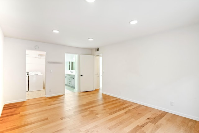 2624 State St # 1, Santa Barbara, CA 93105 - spare room with light wood-type flooring, recessed lighting, and washer and clothes dryer