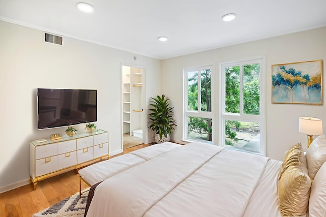 2624 State St # 1, Santa Barbara, CA 93105 - bedroom with light wood-style floors, ornamental molding, a walk in closet, and recessed lighting