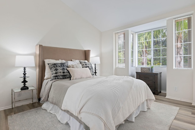3773 Greggory Way Unit 2, Santa Barbara, CA 93105 - bedroom with light wood finished floors, baseboards, and lofted ceiling