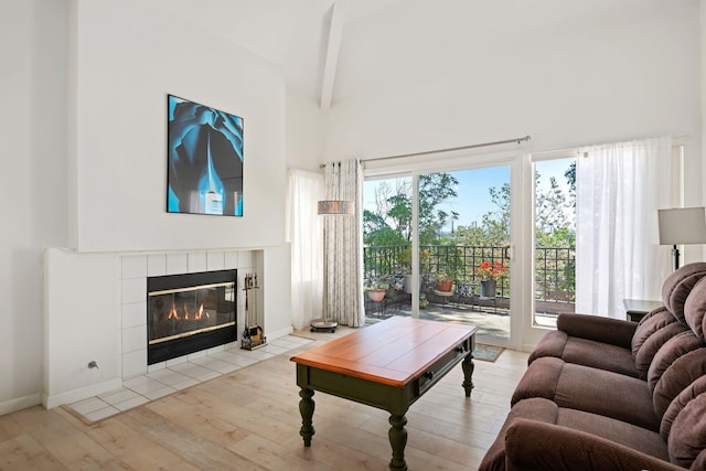 5965 Paseo Encantada, Camarillo, CA 93012 - living room featuring a fireplace, wood finished floors, beam ceiling, and high vaulted ceiling