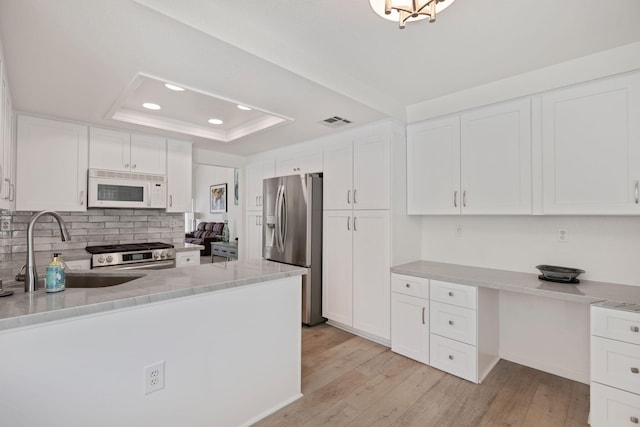 5965 Paseo Encantada, Camarillo, CA 93012 - kitchen featuring stainless steel appliances, a sink, decorative backsplash, recessed lighting, and white cabinets