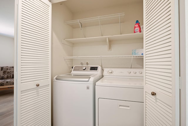 5965 Paseo Encantada, Camarillo, CA 93012 - washroom with separate washer and dryer and wood finished floors