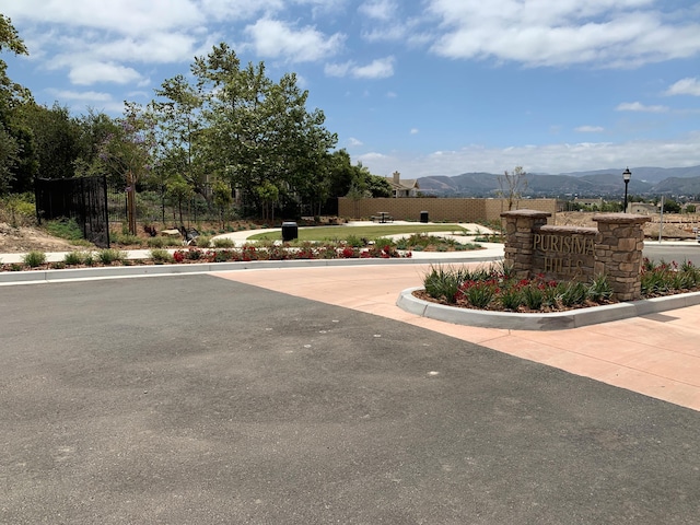 150 White Sage Ln, Lompoc, CA 93436 - view of road with street lights, a mountain view, and curbs