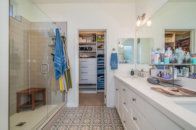 150 White Sage Ln, Lompoc, CA 93436 - bathroom featuring a walk in closet, double vanity, and a shower stall