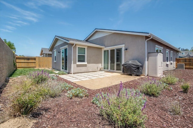 150 White Sage Ln, Lompoc, CA 93436 - rear view of property featuring stucco siding, a fenced backyard, and a patio area