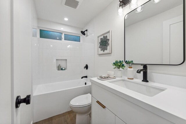 730 Meigs Rd, Santa Barbara, CA 93109 - bathroom featuring wood finished floors, vanity, toilet, and washtub / shower combination