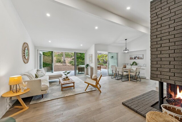 730 Meigs Rd, Santa Barbara, CA 93109 - living area featuring lofted ceiling, light wood-type flooring, recessed lighting, and a fireplace