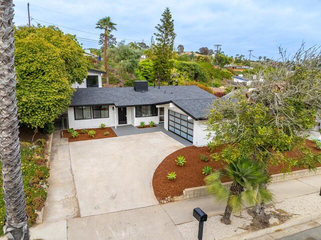 730 Meigs Rd, Santa Barbara, CA 93109 - view of front of property with a garage, driveway, and a shingled roof