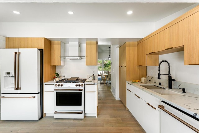 730 Meigs Rd, Santa Barbara, CA 93109 - kitchen featuring white appliances, wall chimney range hood, a sink, light wood-style floors, and recessed lighting