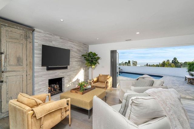 530 Ricardo Ave, Santa Barbara, CA 93109 - living room with a fireplace, wood finished floors, and recessed lighting