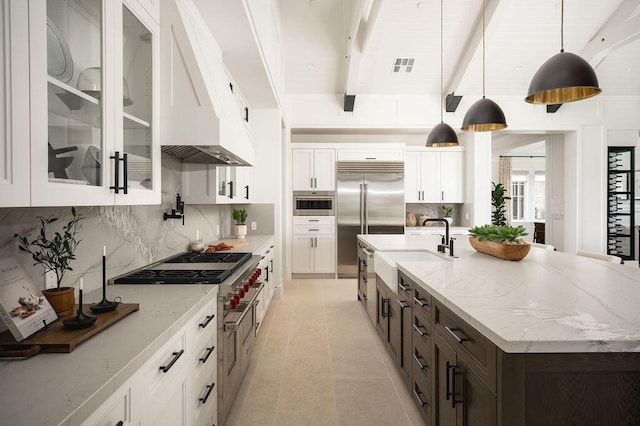 120 Polo Way, Carpinteria, CA 93013 - kitchen with a sink, decorative backsplash, white cabinets, cooktop, and beam ceiling