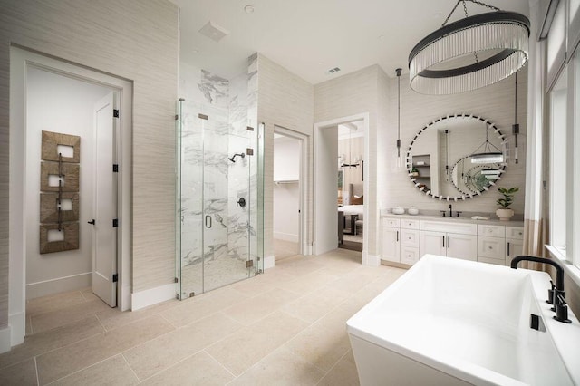 120 Polo Way, Carpinteria, CA 93013 - full bath featuring a marble finish shower, vanity, a soaking tub, and baseboards