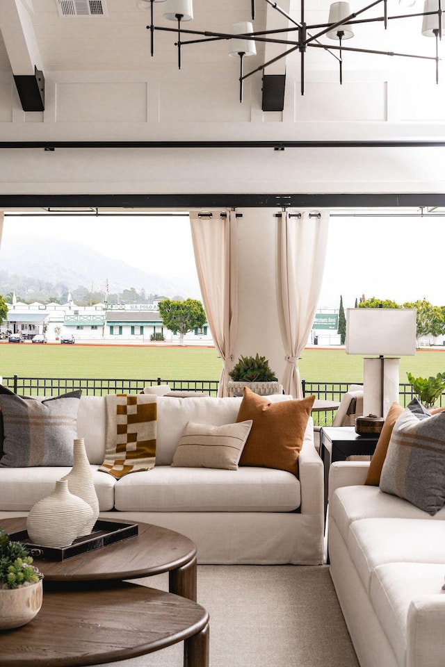 120 Polo Way, Carpinteria, CA 93013 - living area featuring a mountain view, healthy amount of natural light, and a chandelier