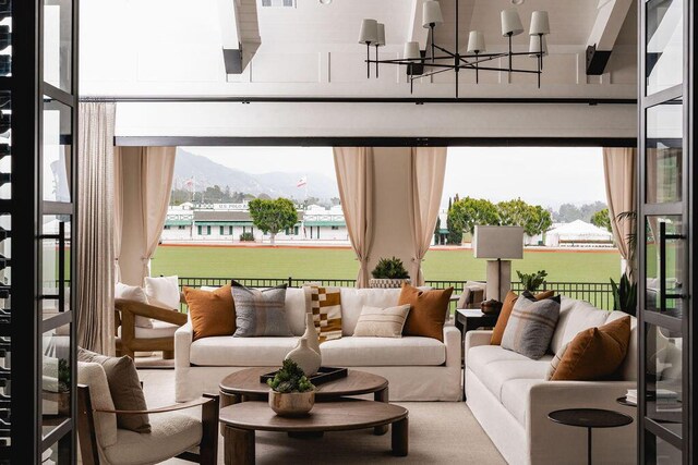 120 Polo Way, Carpinteria, CA 93013 - living area with a mountain view, a chandelier, and plenty of natural light
