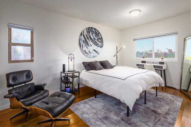 128 Las Alturas Rd, Santa Barbara, CA 93103 - bedroom featuring multiple windows and wood finished floors