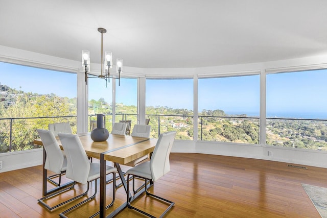 128 Las Alturas Rd, Santa Barbara, CA 93103 - sunroom / solarium featuring a chandelier and hardwood / wood-style floors