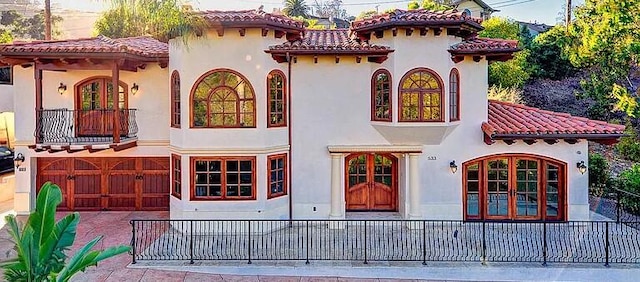533 Conejo Rd, Santa Barbara, CA 93103 - rear view of property featuring a balcony, stucco siding, and a tiled roof