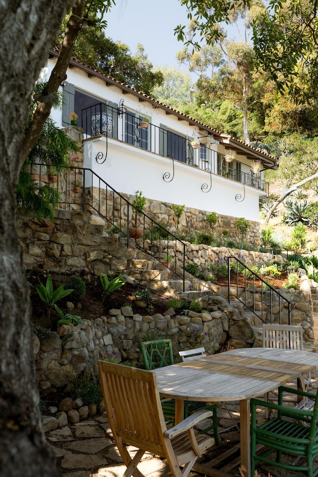 15 Loma Media Rd, Santa Barbara, CA 93103 - exterior space with stairway, outdoor dining space, a tiled roof, and a patio