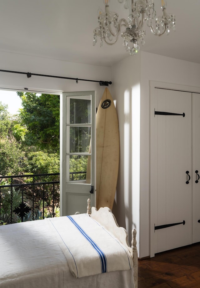 15 Loma Media Rd, Santa Barbara, CA 93103 - bedroom featuring dark wood-style flooring, a chandelier, and multiple windows