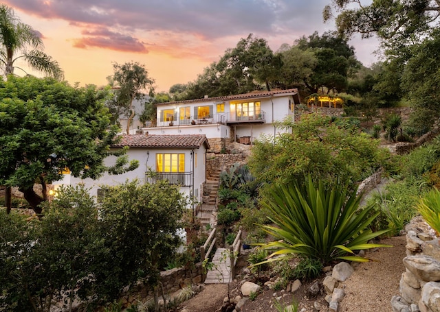 15 Loma Media Rd, Santa Barbara, CA 93103 - view of front of property featuring stucco siding, a balcony, a tiled roof, and stairway
