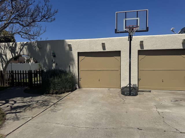 560 S 12th St, Grover Beach, CA 93433 - view of side of home with stucco siding, driveway, and an attached garage