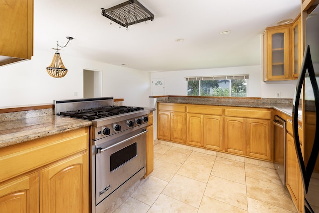 5003 Rhoads Ave, Santa Barbara, CA 93111 - kitchen featuring stainless steel appliances, light stone countertops, glass insert cabinets, a peninsula, and hanging light fixtures